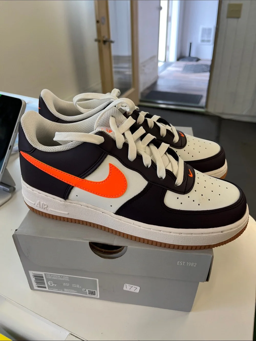 Nike Air Force 1’s Men’s Low-Top Sneakers - Black/White with Orange Swoosh